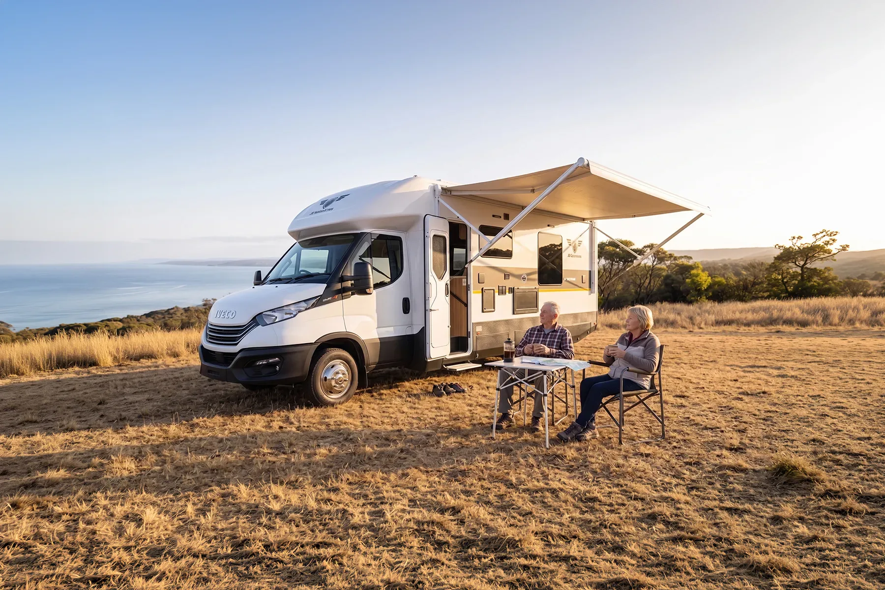 JB motorhome beside the water