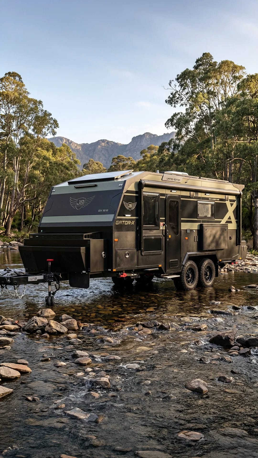 A JB caravan set up among gums